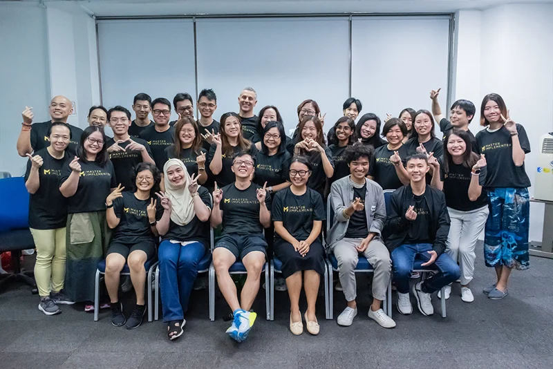 The photo used on Marc’s Facebook cover, with the MI community in matching shirts.