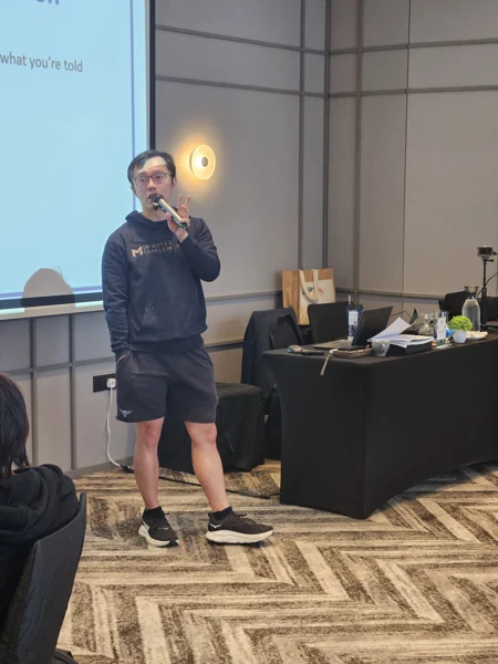 Portrait orientation, with Marc speaking in his Master Implementer hoodie.